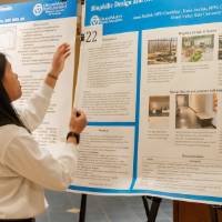 Annie setting up the research poster